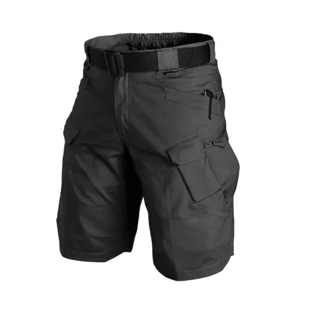 Black tactical shorts with multiple pockets and a belt on a black background